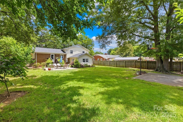 2919 Dunaire Dr, Charlotte, NC 28205 - fenced backyard with a patio