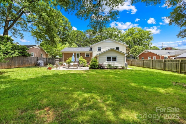 2919 Dunaire Dr, Charlotte, NC 28205 - back of property featuring a patio area, a fenced backyard, and brick siding