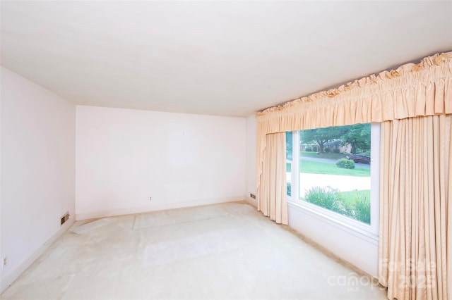1216 Manchester Ln, Charlotte, NC 28227 - unfurnished room with light colored carpet and baseboards