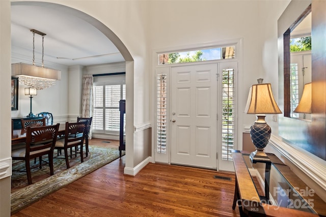 9027 Kirkley Ct, Charlotte, NC 28277 - foyer featuring arched walkways and wood finished floors