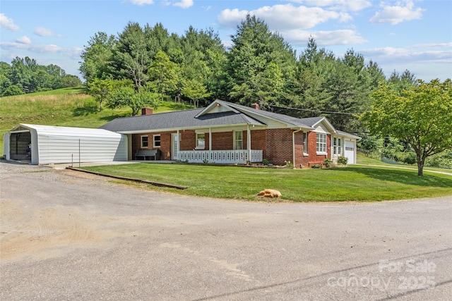 244 Carl Fox Rd, Burnsville, NC 28714 - single story home with covered porch, brick siding, a chimney, and a front yard