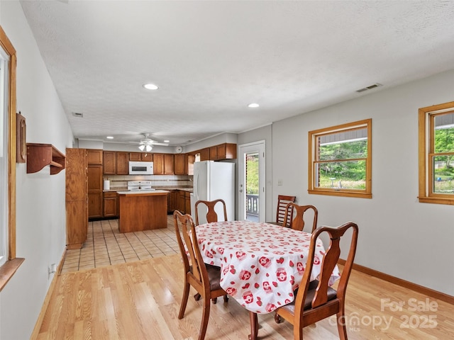244 Carl Fox Rd, Burnsville, NC 28714 - dining room featuring recessed lighting, light wood-style floors, and ceiling fan