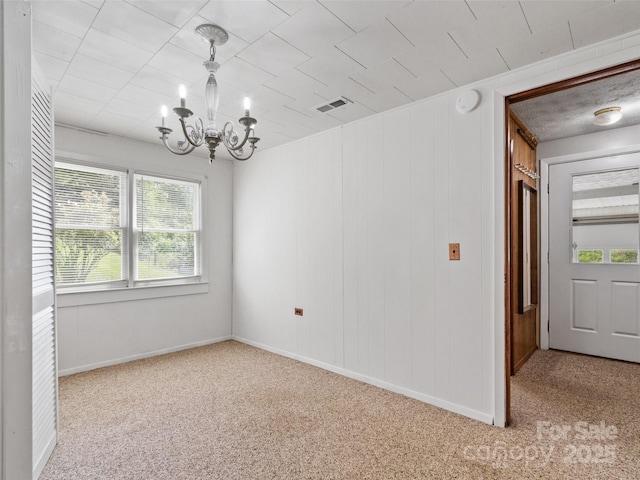 244 Carl Fox Rd, Burnsville, NC 28714 - empty room featuring a chandelier, carpet floors, and a smoke detector