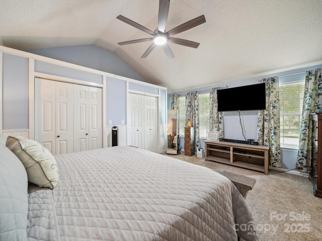 1252 Winding Path Rd, Lake Wylie, SC 29710 - carpeted bedroom with vaulted ceiling, two closets, and a ceiling fan