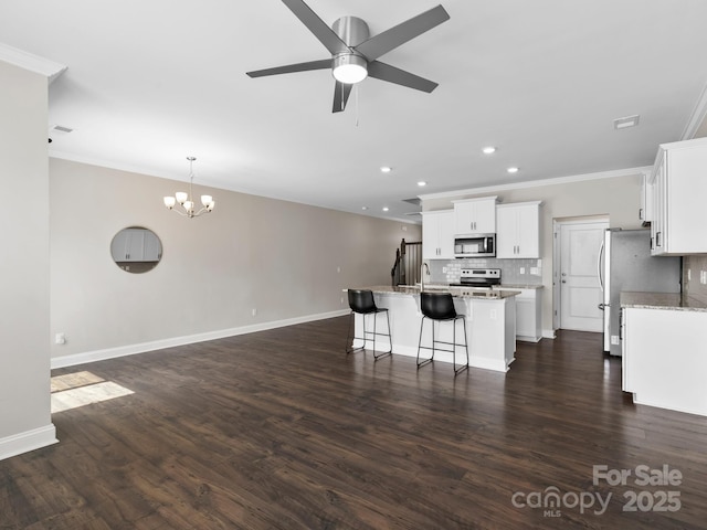567 Big Sur Loop, Asheville, NC 28806 - kitchen featuring stainless steel appliances, crown molding, an island with sink, decorative backsplash, and a chandelier