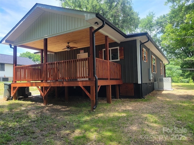 94 James St SW, Concord, NC 28025 - rear view of house featuring a ceiling fan, a wooden deck, and board and batten siding