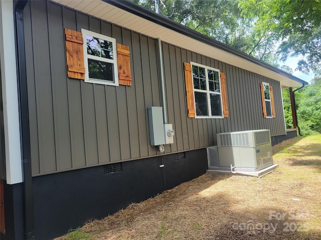 94 James St SW, Concord, NC 28025 - view of side of property featuring crawl space and board and batten siding