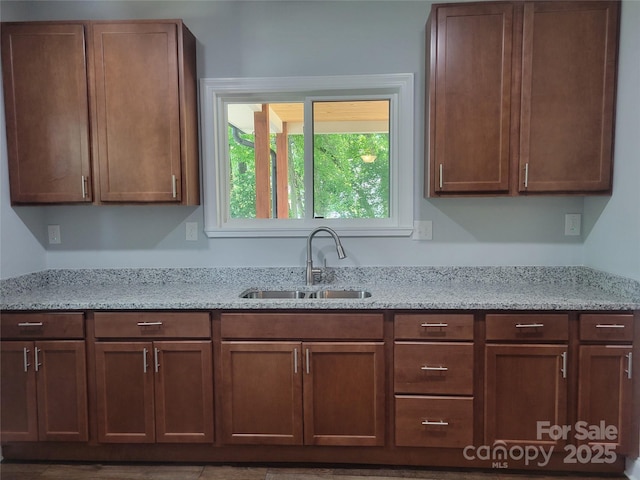 94 James St SW, Concord, NC 28025 - kitchen featuring a sink and light stone countertops