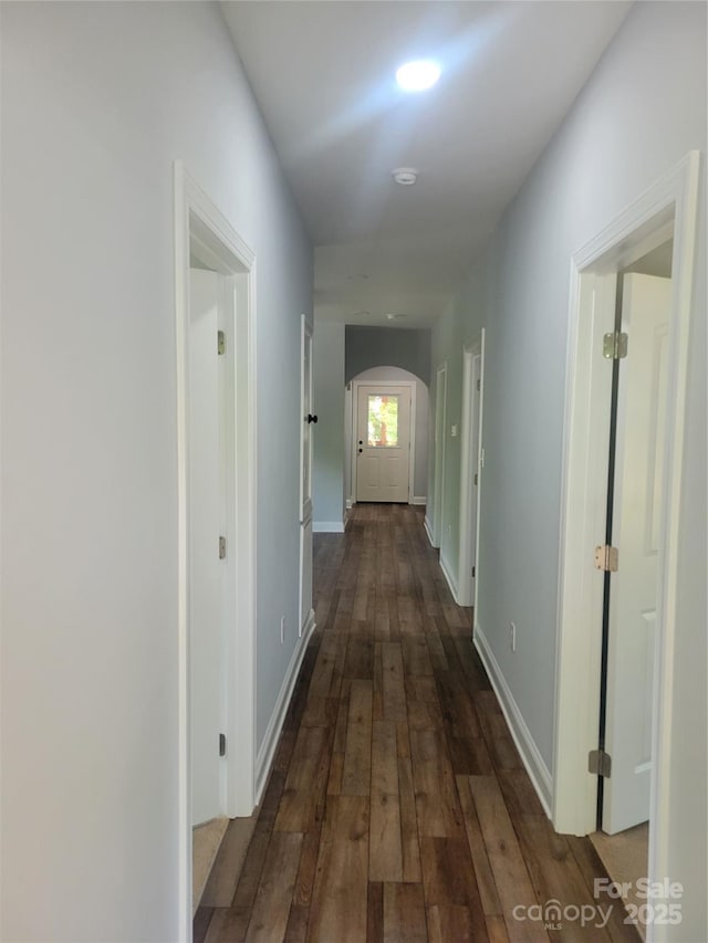 94 James St SW, Concord, NC 28025 - hallway featuring arched walkways and dark wood-style floors
