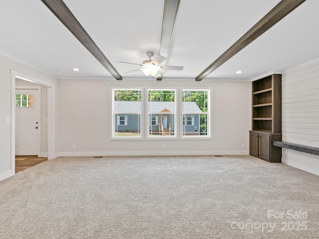 206 Walnut Branch Rd, Weaverville, NC 28787 - unfurnished living room with light colored carpet, beamed ceiling, healthy amount of natural light, a ceiling fan, and ornamental molding