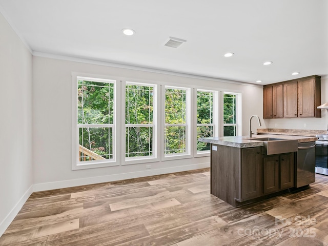 206 Walnut Branch Rd, Weaverville, NC 28787 - kitchen with stainless steel dishwasher, crown molding, light countertops, range, and a center island with sink