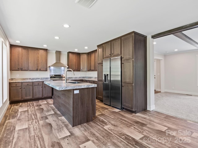 206 Walnut Branch Rd, Weaverville, NC 28787 - kitchen featuring stainless steel fridge, wall chimney exhaust hood, recessed lighting, an island with sink, and light wood finished floors