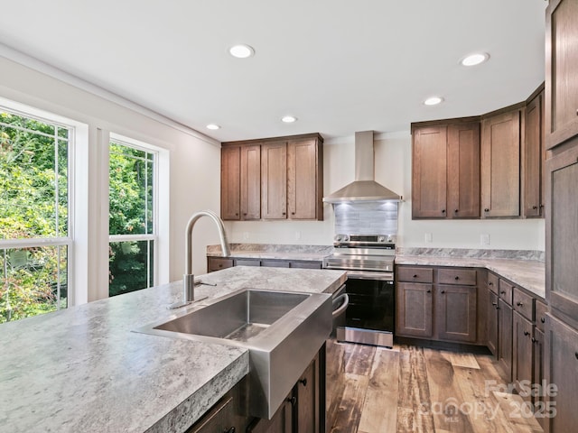 206 Walnut Branch Rd, Weaverville, NC 28787 - kitchen with wall chimney range hood, stainless steel range with electric stovetop, recessed lighting, light wood-style floors, and decorative backsplash