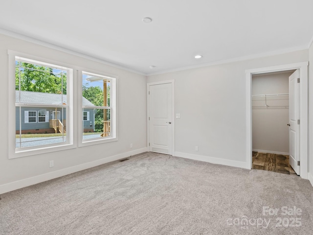 206 Walnut Branch Rd, Weaverville, NC 28787 - unfurnished bedroom with carpet floors, a walk in closet, and ornamental molding