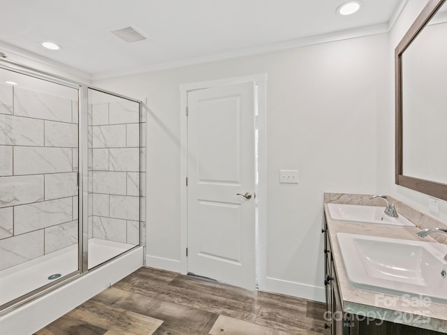 206 Walnut Branch Rd, Weaverville, NC 28787 - bathroom featuring double vanity, a shower stall, recessed lighting, wood finished floors, and crown molding