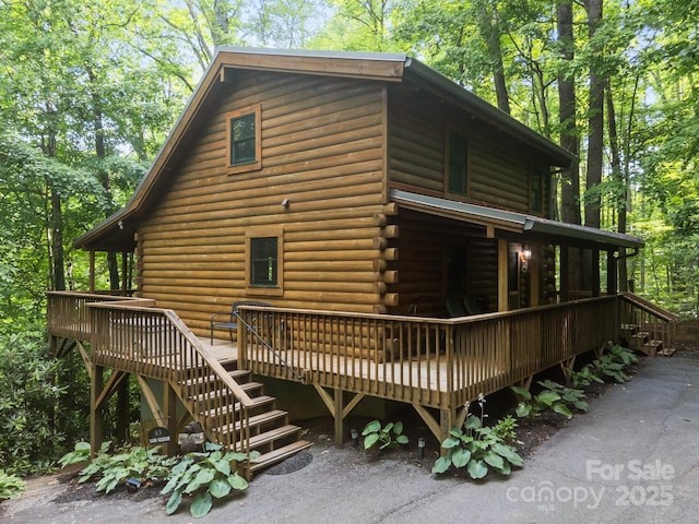 83 Log Cabin Dr, Maggie Valley, NC 28751 - back of house featuring log exterior, a deck, and stairs