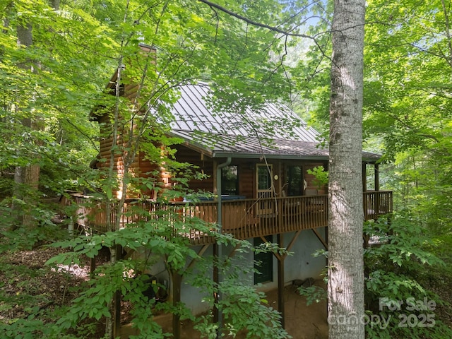83 Log Cabin Dr, Maggie Valley, NC 28751 - back of house featuring a chimney, a metal roof, a standing seam roof, and a wooden deck