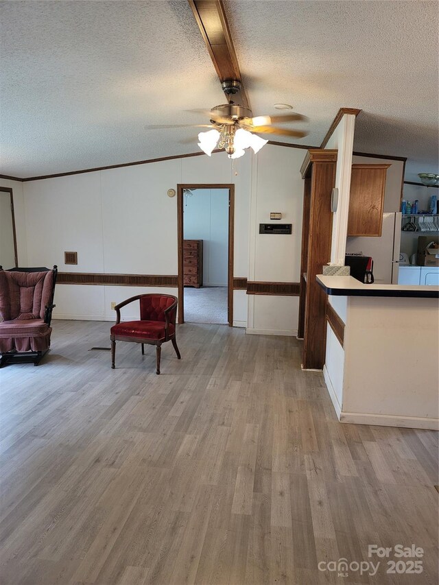 111 Crystal Creek Dr, China Grove, NC 28023 - living area featuring a textured ceiling, wood finished floors, ceiling fan, and beam ceiling