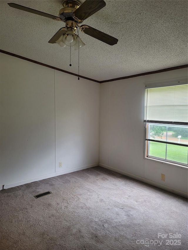 111 Crystal Creek Dr, China Grove, NC 28023 - spare room with carpet floors, a textured ceiling, ornamental molding, and a ceiling fan
