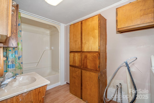 439 Neisler Rd, Concord, NC 28025 - bathroom with wood finished floors, vanity, and shower / bathtub combination with curtain