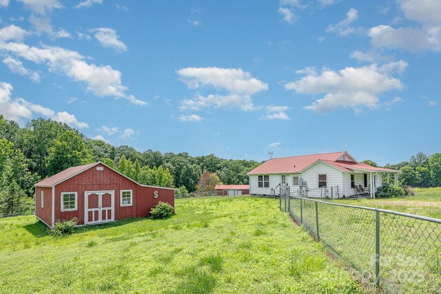 439 Neisler Rd, Concord, NC 28025 - view of yard featuring a storage shed