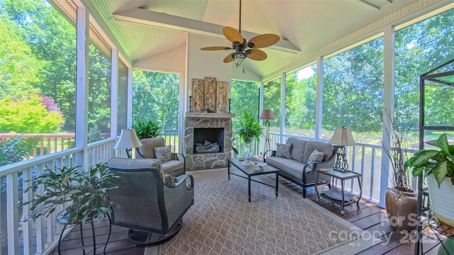 1240 Fawn Ridge Rd NW, Concord, NC 28027 - sunroom with a ceiling fan, an outdoor living space with a fireplace, plenty of natural light, and lofted ceiling