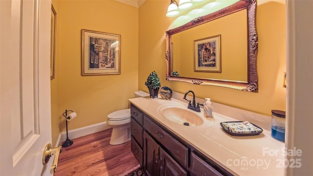 1240 Fawn Ridge Rd NW, Concord, NC 28027 - half bathroom featuring vanity, wood finished floors, and ornamental molding