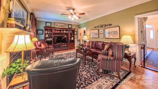 1240 Fawn Ridge Rd NW, Concord, NC 28027 - living area featuring a ceiling fan, wood finished floors, and ornamental molding