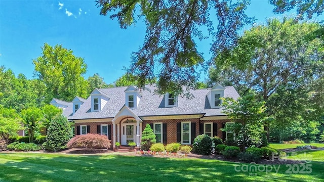 1240 Fawn Ridge Rd NW, Concord, NC 28027 - cape cod house with brick siding and a front lawn