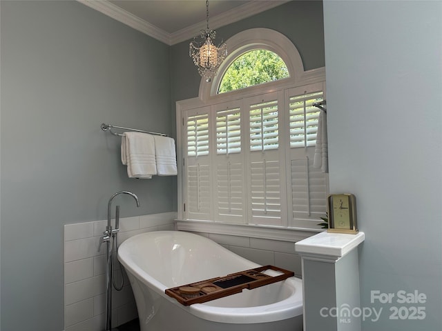 1240 Fawn Ridge Rd NW, Concord, NC 28027 - full bath featuring a soaking tub, a chandelier, crown molding, and tile walls