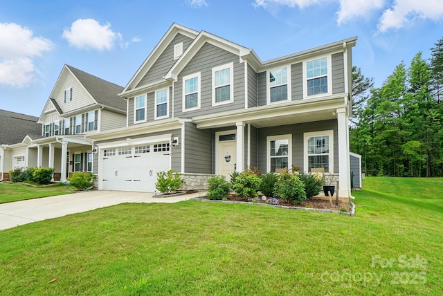 812 Dogwood Creek Ln, Indian Trail, NC 28079 - view of front facade featuring concrete driveway, covered porch, an attached garage, and a front lawn