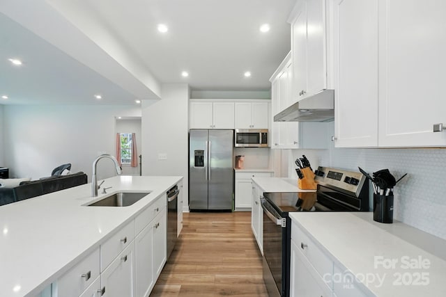 812 Dogwood Creek Ln, Indian Trail, NC 28079 - kitchen with stainless steel appliances, under cabinet range hood, white cabinets, light countertops, and recessed lighting