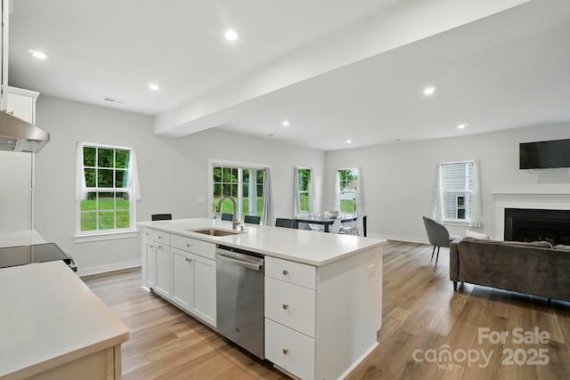 812 Dogwood Creek Ln, Indian Trail, NC 28079 - kitchen featuring stainless steel dishwasher, an island with sink, light wood-type flooring, light countertops, and recessed lighting