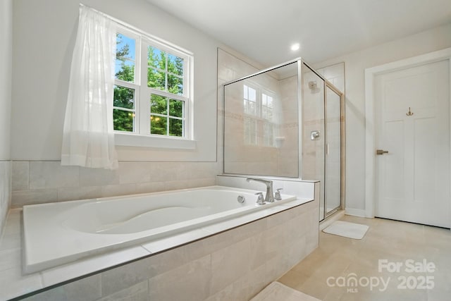 812 Dogwood Creek Ln, Indian Trail, NC 28079 - full bathroom featuring a garden tub, a stall shower, and tile patterned flooring