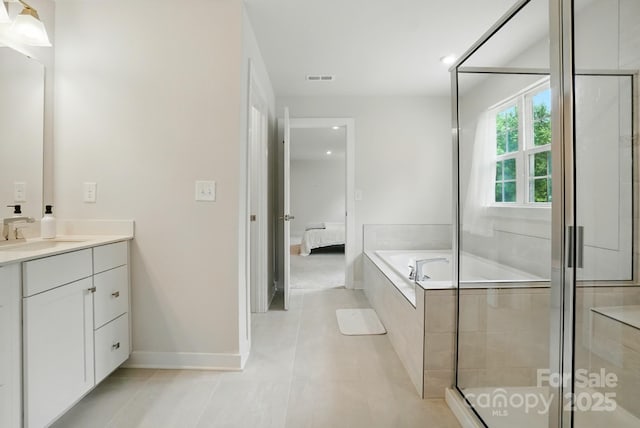 812 Dogwood Creek Ln, Indian Trail, NC 28079 - ensuite bathroom with vanity, a bath, tile patterned floors, and a stall shower