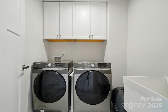 812 Dogwood Creek Ln, Indian Trail, NC 28079 - laundry room featuring washer and clothes dryer and cabinet space