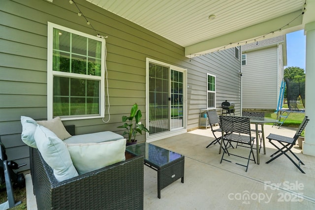 812 Dogwood Creek Ln, Indian Trail, NC 28079 - view of patio / terrace with a trampoline, an outdoor hangout area, outdoor dining space, and area for grilling