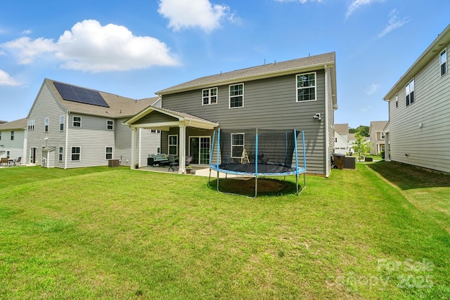 812 Dogwood Creek Ln, Indian Trail, NC 28079 - back of house featuring a trampoline, a patio area, and a yard