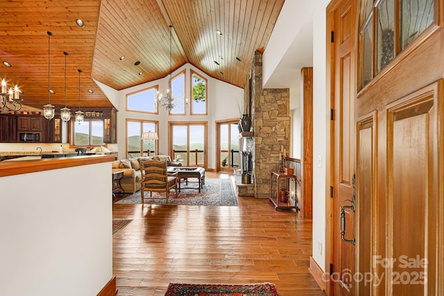 197 Cherry Knob Dr Unit 23, Mars Hill, NC 28754 - living room featuring high vaulted ceiling, hardwood / wood-style flooring, wood ceiling, and a chandelier