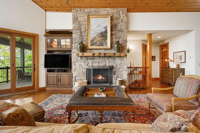 197 Cherry Knob Dr Unit 23, Mars Hill, NC 28754 - living room with wood ceiling, wood finished floors, a fireplace, and a high ceiling