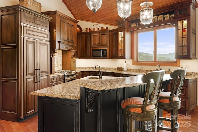197 Cherry Knob Dr Unit 23, Mars Hill, NC 28754 - kitchen with black microwave, lofted ceiling, wood ceiling, wood finished floors, and stainless steel range with gas cooktop