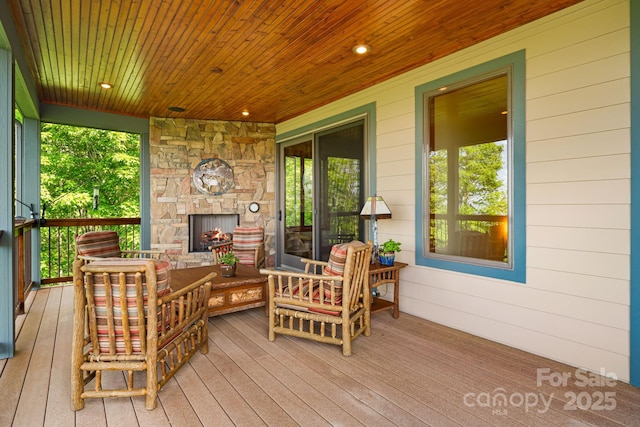 197 Cherry Knob Dr Unit 23, Mars Hill, NC 28754 - wooden porch with an outdoor stone fireplace