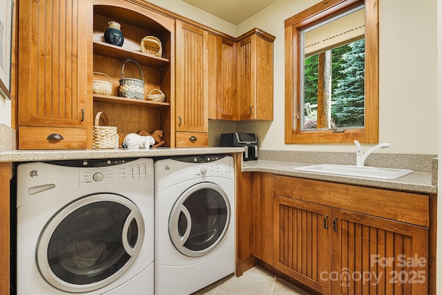 197 Cherry Knob Dr Unit 23, Mars Hill, NC 28754 - laundry room featuring independent washer and dryer, cabinet space, and light tile patterned floors