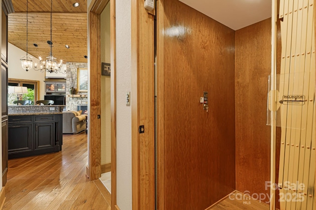 197 Cherry Knob Dr Unit 23, Mars Hill, NC 28754 - hall with light wood finished floors, wood ceiling, a chandelier, and lofted ceiling