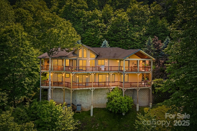 197 Cherry Knob Dr Unit 23, Mars Hill, NC 28754 - rear view of house featuring a balcony and a wooded view