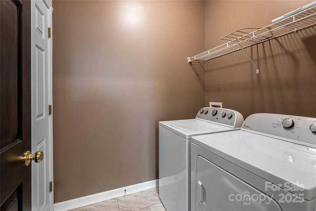 89 Woodfern Rd, Fletcher, NC 28732 - washroom featuring separate washer and dryer and light marble finish floors