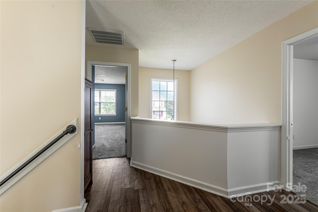 89 Woodfern Rd, Fletcher, NC 28732 - corridor featuring an upstairs landing, a textured ceiling, and dark wood-style flooring