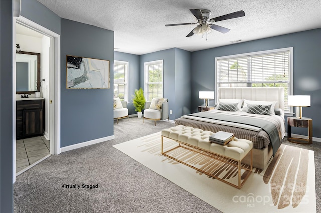 89 Woodfern Rd, Fletcher, NC 28732 - carpeted bedroom featuring ensuite bathroom, a textured ceiling, and a ceiling fan
