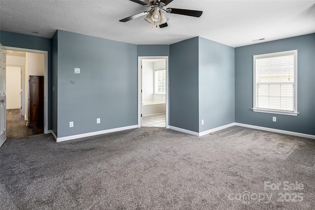 89 Woodfern Rd, Fletcher, NC 28732 - unfurnished bedroom featuring a textured ceiling, carpet flooring, ceiling fan, and ensuite bath