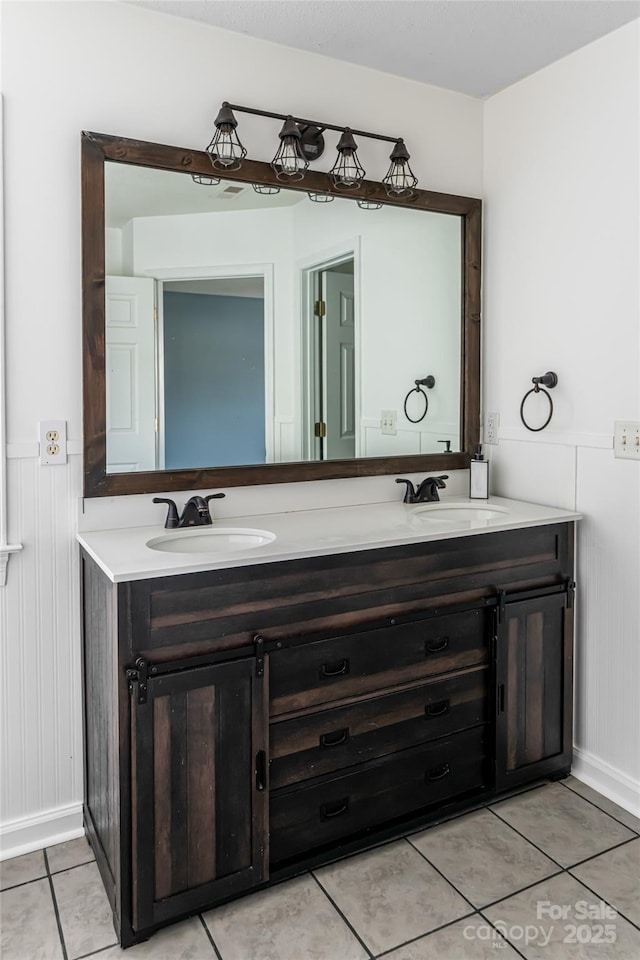89 Woodfern Rd, Fletcher, NC 28732 - bathroom with double vanity, a wainscoted wall, and tile patterned flooring